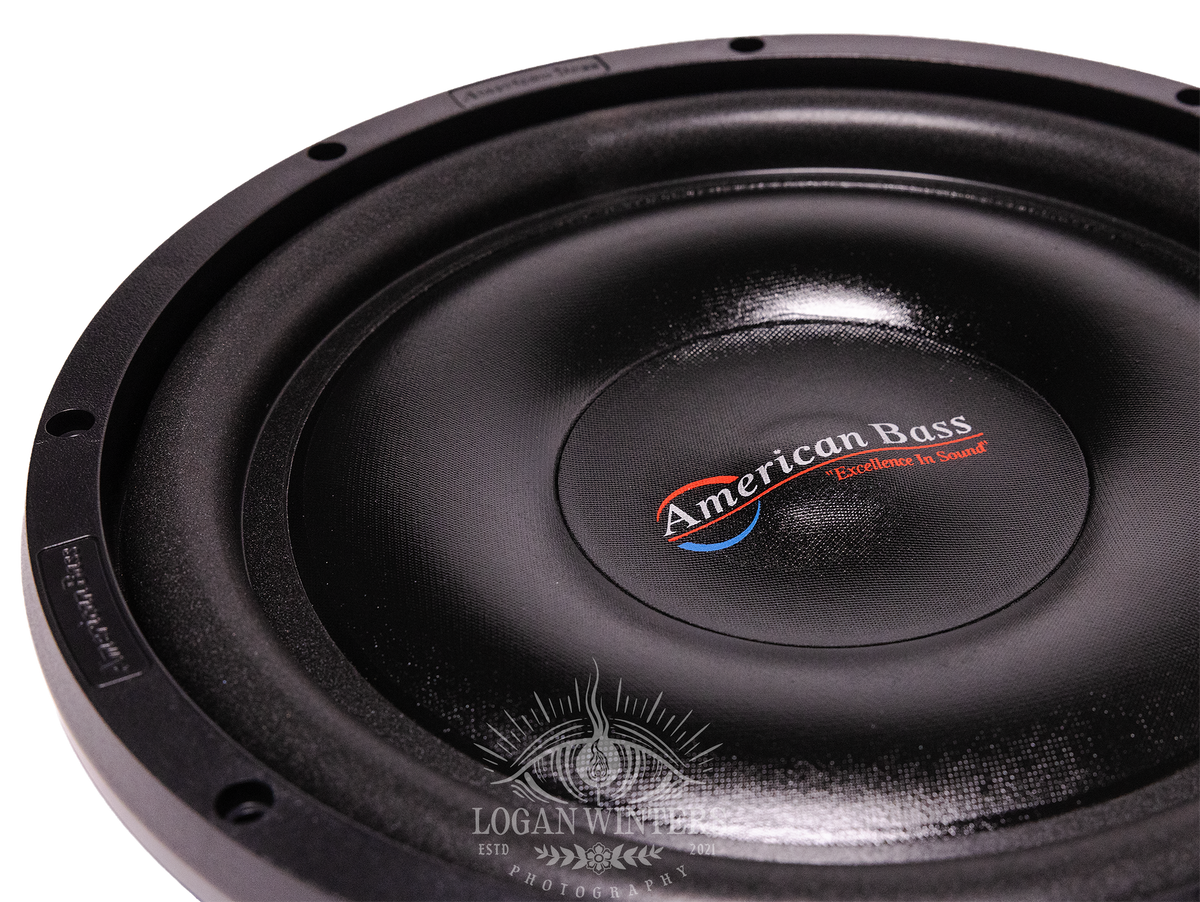 Close-up of a black American Bass SL 12″ Car Subwoofer with “Excellence in Sound” text at the center, featuring a single voice coil (4 Ohm) and 300 Watts RMS (Shallow Mount), photographed on a white background.