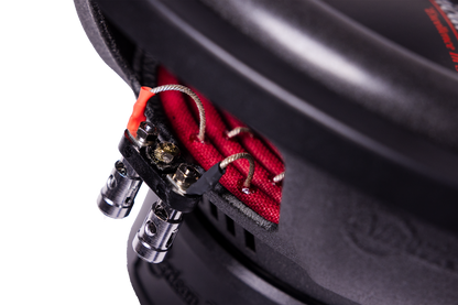 Close-up of the wiring terminals on the American Bass Audio Ground Pound Bundle—featuring silver wires connected to metal connectors and red fabric material inside the enclosure—perfectly suited for setups with a VFL Rebel REBEL-3000.1 amplifier and dual DX 12" subwoofers.