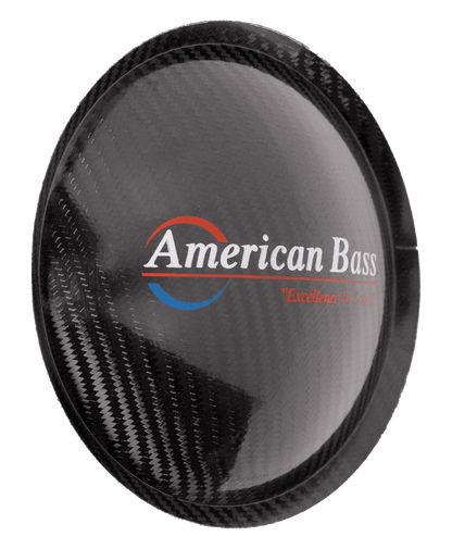 American Bass logo on a carbon fiber subwoofer cone cover, emphasizing quality and sound enhancement.